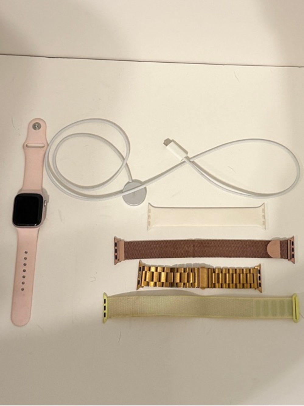 Apple Smartwatch with Light Pink Sport Band, 4 Extra Bands, and charger